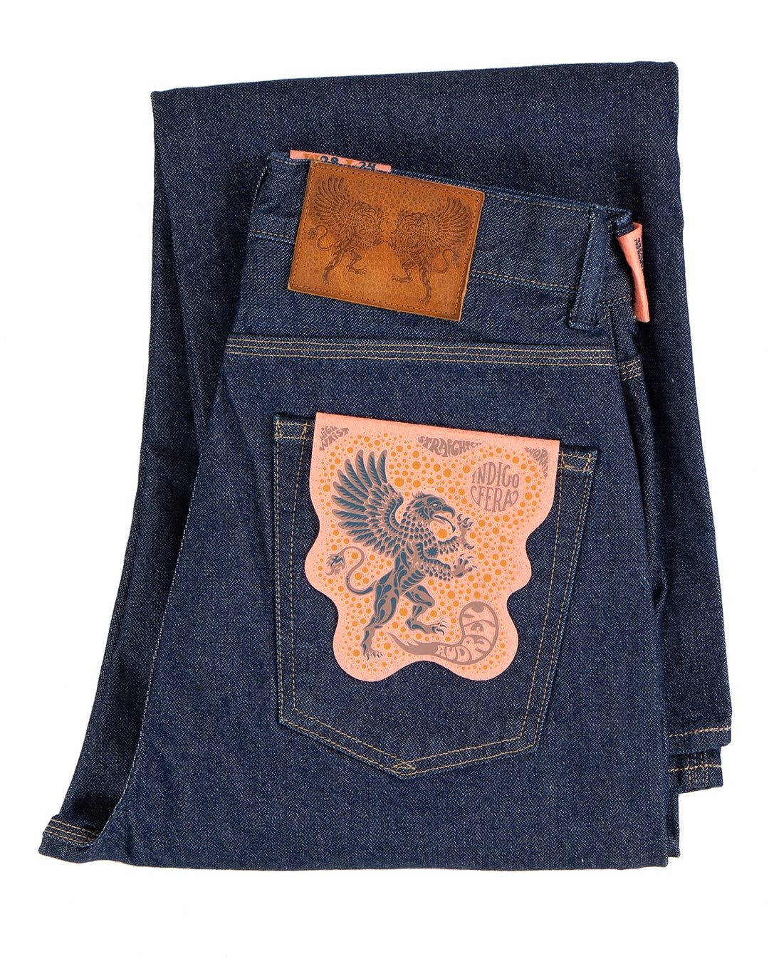 Folded blue denim jeans with Indigofera brand logo