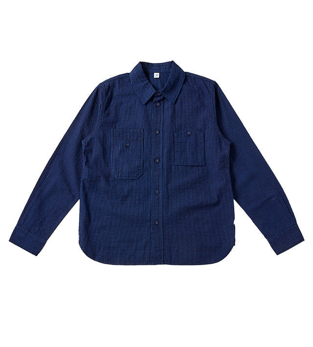 A dark navy blue long-sleeve button-up shirt with two chest pockets, laid flat against a solid white background.